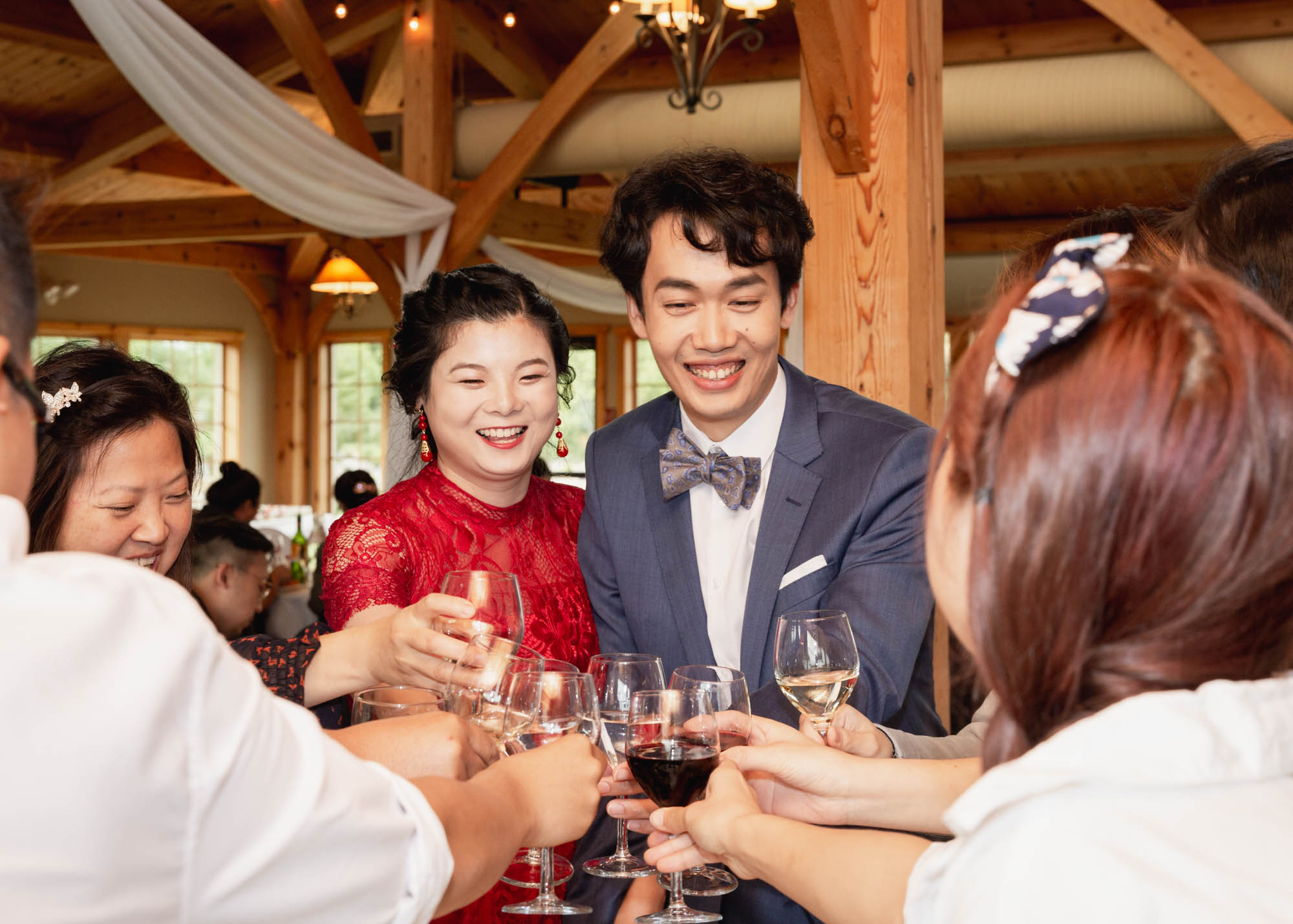 Image description: Photos of the newlyweds entering the reception venue and being greeted by guests.