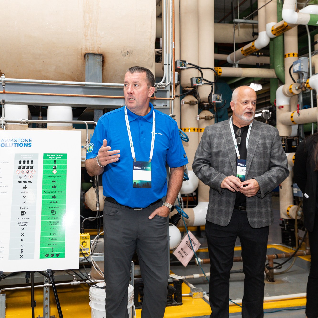 Image description: Experts in short blue sleeves answer questions from participants. The other two are involved in the discussion. Text reads: HAWKSTONE SOLUTIONS