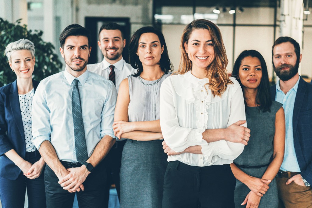 Half-Body shot of four women and three men.